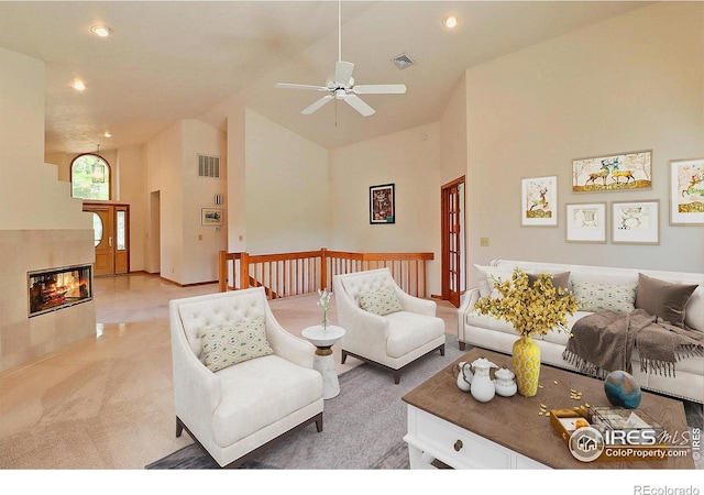 1357 43rd Ave Unit 60, Greeley, CO 80634 - living room with light colored carpet, high vaulted ceiling, recessed lighting, a ceiling fan, and a tile fireplace