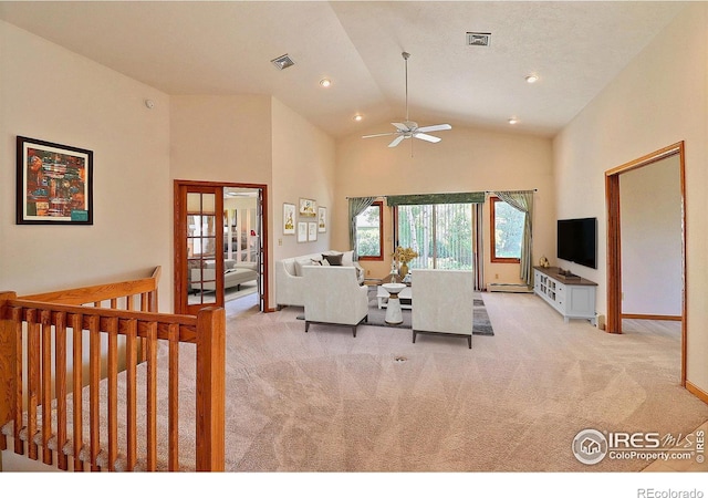 1357 43rd Ave Unit 60, Greeley, CO 80634 - living room featuring light carpet, ceiling fan, recessed lighting, baseboard heating, and high vaulted ceiling