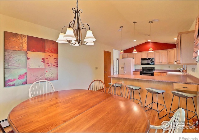 1357 43rd Ave Unit 60, Greeley, CO 80634 - dining room with vaulted ceiling and a chandelier