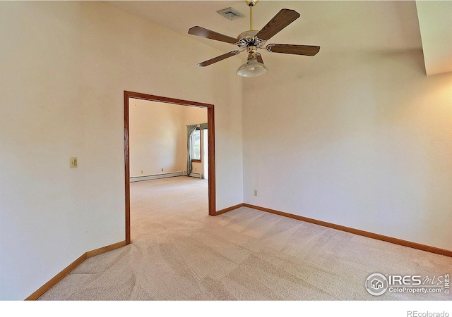 1357 43rd Ave Unit 60, Greeley, CO 80634 - unfurnished room featuring light colored carpet, a baseboard heating unit, ceiling fan, and a high ceiling