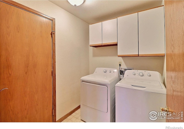 1357 43rd Ave Unit 60, Greeley, CO 80634 - washroom with cabinet space, washer and dryer, and light flooring