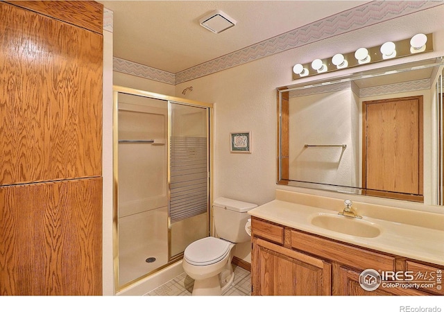 1357 43rd Ave Unit 60, Greeley, CO 80634 - bathroom featuring a shower stall, vanity, and tile patterned flooring