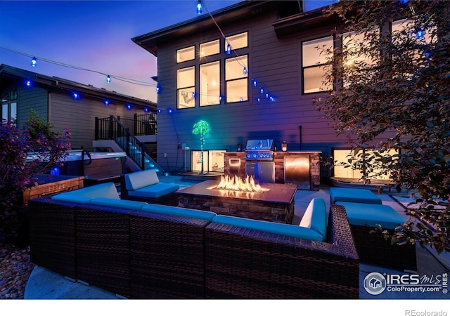 2772 Vallecito St, Timnath, CO 80547 - view of patio featuring an outdoor living space with a fire pit, stairs, and area for grilling