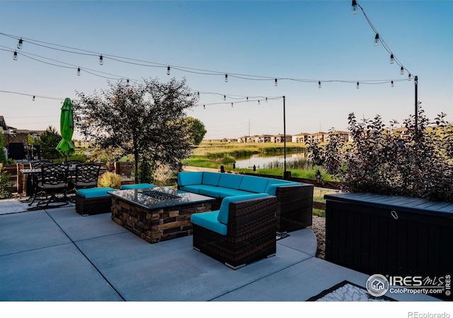 2772 Vallecito St, Timnath, CO 80547 - view of patio with an outdoor living space with a fire pit and a water view