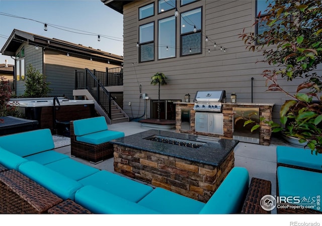 2772 Vallecito St, Timnath, CO 80547 - view of patio / terrace featuring an outdoor living space with a fire pit, a hot tub, an outdoor kitchen, and stairway