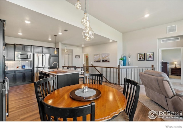 2772 Vallecito St, Timnath, CO 80547 - dining room with wood finished floors and recessed lighting
