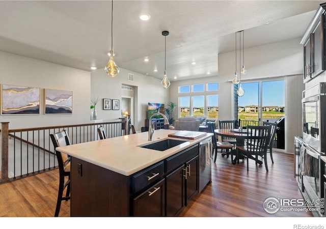 2772 Vallecito St, Timnath, CO 80547 - kitchen with dark wood-type flooring, recessed lighting, light countertops, stainless steel appliances, and pendant lighting
