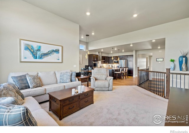 2772 Vallecito St, Timnath, CO 80547 - living room with recessed lighting and light wood-style flooring