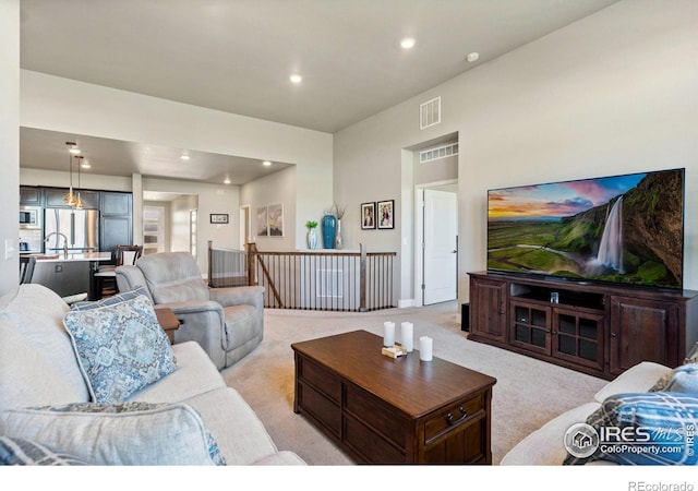 2772 Vallecito St, Timnath, CO 80547 - living area featuring light colored carpet and recessed lighting