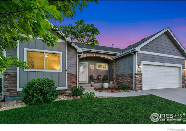 83 Evans St, Severance, CO 80550 - single story home featuring board and batten siding, an attached garage, stone siding, and driveway