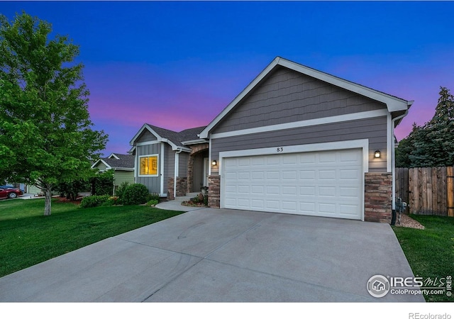 83 Evans St, Severance, CO 80550 - ranch-style house with stone siding, driveway, a garage, and board and batten siding