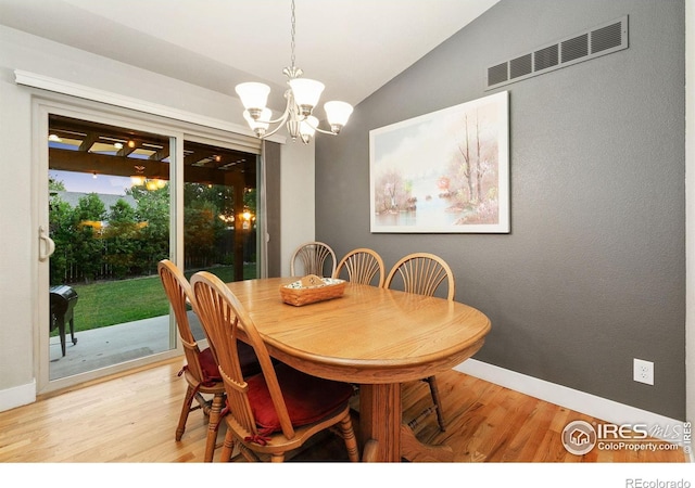 83 Evans St, Severance, CO 80550 - dining area featuring light wood finished floors, lofted ceiling, and a chandelier