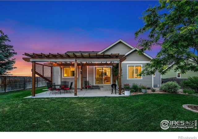 83 Evans St, Severance, CO 80550 - back of property at dusk featuring a fenced backyard, a pergola, and a patio area