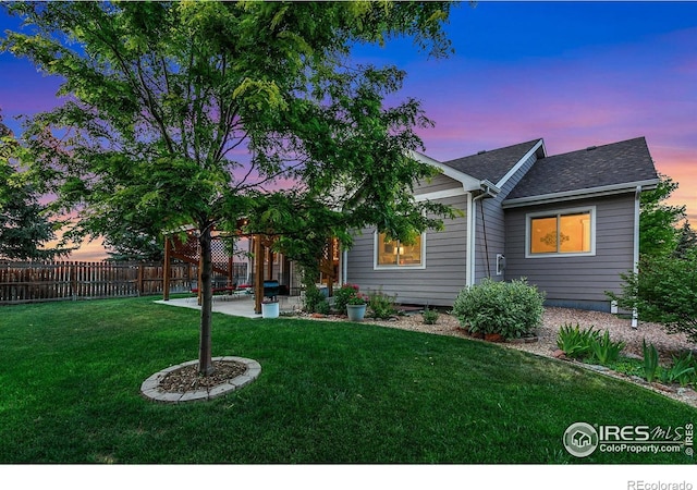 83 Evans St, Severance, CO 80550 - back of property with a patio and a shingled roof
