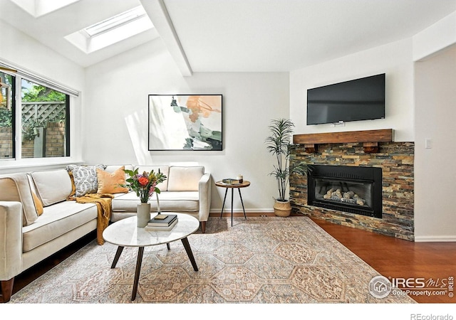 770 Quince Cir, Boulder, CO 80304 - living area with a skylight, wood finished floors, a fireplace, and lofted ceiling