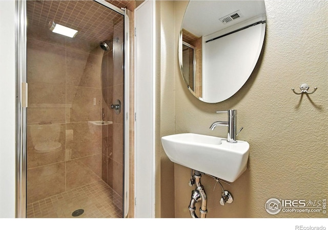 770 Quince Cir, Boulder, CO 80304 - bathroom with a shower stall and a textured wall