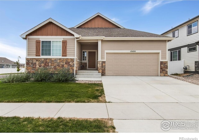 10400 17th St, Greeley, CO 80634 - craftsman house with stone siding, board and batten siding, an attached garage, a front lawn, and concrete driveway