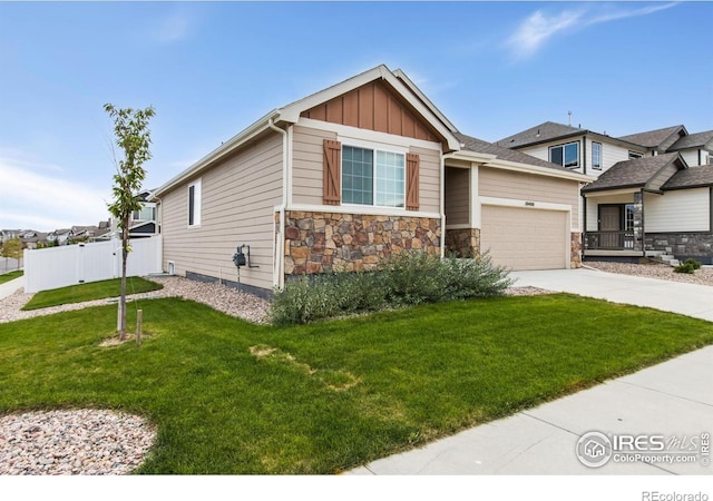 10400 17th St, Greeley, CO 80634 - craftsman house featuring board and batten siding, an attached garage, driveway, and stone siding