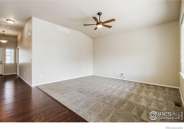 10400 17th St, Greeley, CO 80634 - spare room featuring ceiling fan, lofted ceiling, and dark wood-type flooring