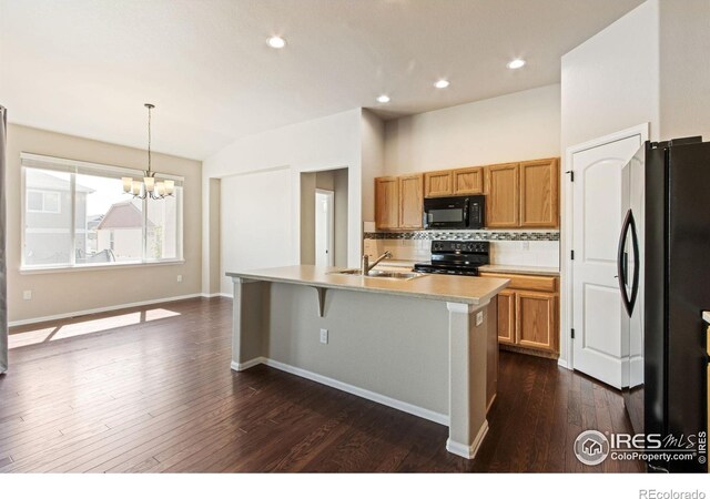 10400 17th St, Greeley, CO 80634 - kitchen with black appliances, backsplash, dark wood-style flooring, a chandelier, and light countertops