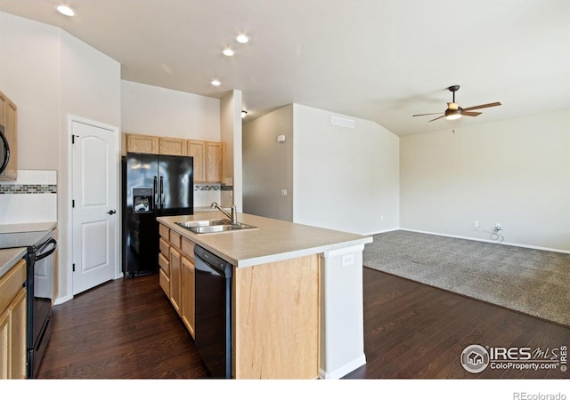10400 17th St, Greeley, CO 80634 - kitchen featuring black appliances, light brown cabinetry, ceiling fan, dark wood-style flooring, and an island with sink