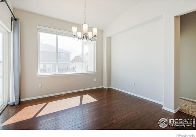 10400 17th St, Greeley, CO 80634 - unfurnished dining area featuring hardwood / wood-style flooring, a chandelier, and lofted ceiling