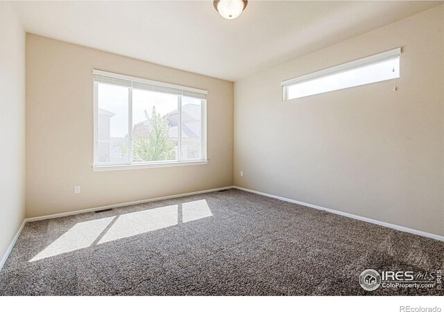 10400 17th St, Greeley, CO 80634 - carpeted empty room featuring baseboards