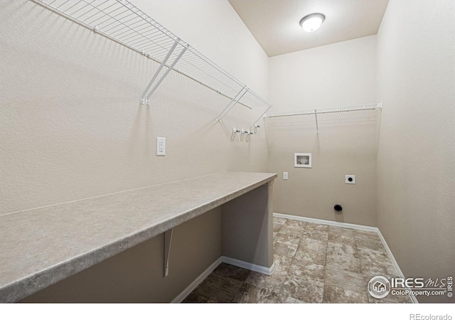10400 17th St, Greeley, CO 80634 - laundry area featuring hookup for a washing machine, hookup for an electric dryer, and dark stone finish floors