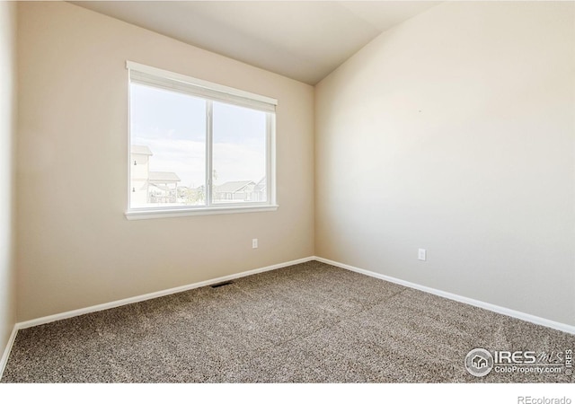10400 17th St, Greeley, CO 80634 - carpeted spare room featuring vaulted ceiling and baseboards