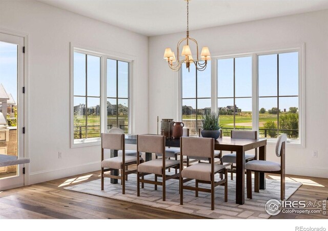 2568 Southwind Rd, Berthoud, CO 80513 - dining area featuring a chandelier and wood finished floors