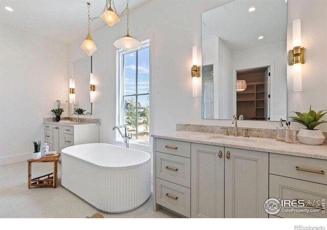 2568 Southwind Rd, Berthoud, CO 80513 - bathroom with vanity, a freestanding tub, and recessed lighting