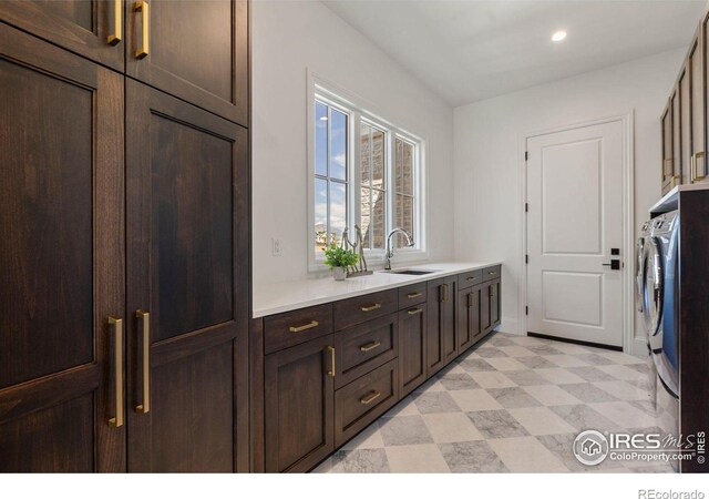 2568 Southwind Rd, Berthoud, CO 80513 - laundry area with cabinet space, independent washer and dryer, recessed lighting, and light floors