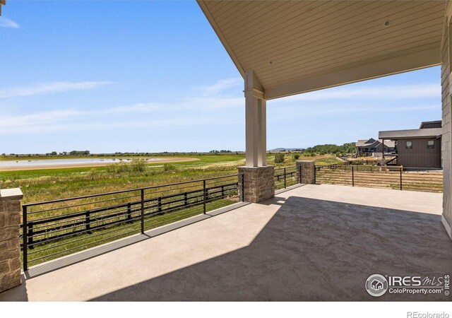 2568 Southwind Rd, Berthoud, CO 80513 - view of patio / terrace with a water view