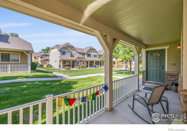 1014 Andrews Peak Dr Unit D112, Fort Collins, CO 80521 - porch with a residential view and a lawn