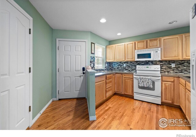 1014 Andrews Peak Dr Unit D112, Fort Collins, CO 80521 - kitchen featuring white appliances, decorative backsplash, light wood finished floors, and recessed lighting