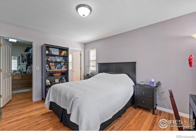 1014 Andrews Peak Dr Unit D112, Fort Collins, CO 80521 - bedroom featuring light wood-type flooring and baseboards