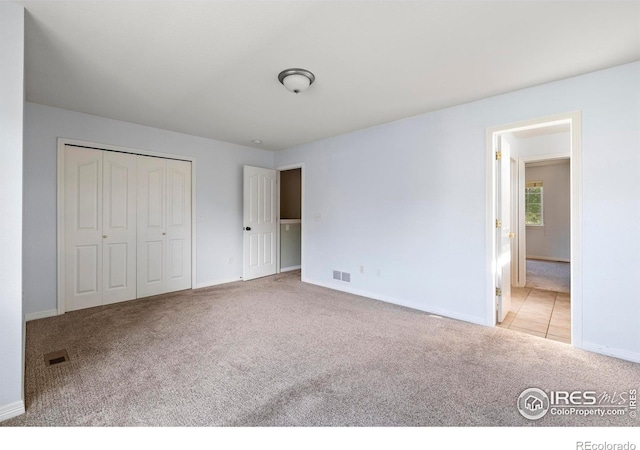 1014 Andrews Peak Dr Unit D112, Fort Collins, CO 80521 - unfurnished bedroom with carpet flooring and a closet