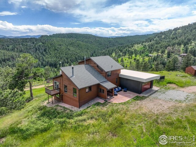 144 Coyote Ct, Boulder, CO 80302 - view of subject property featuring a forest