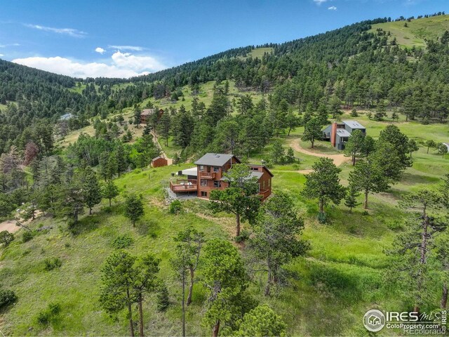 144 Coyote Ct, Boulder, CO 80302 - view of subject property featuring a heavily wooded area