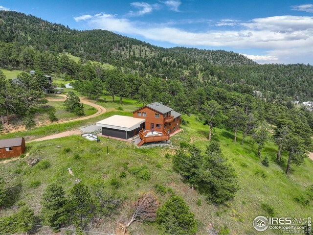 144 Coyote Ct, Boulder, CO 80302 - view of subject property with a forest and a mountainous background