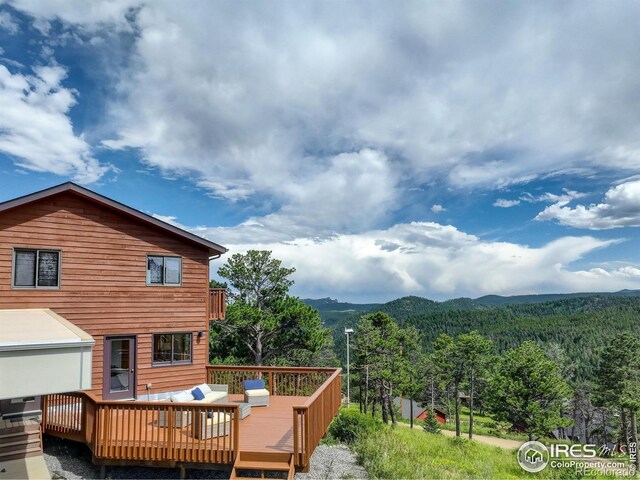 144 Coyote Ct, Boulder, CO 80302 - deck featuring a forest view and a mountain view