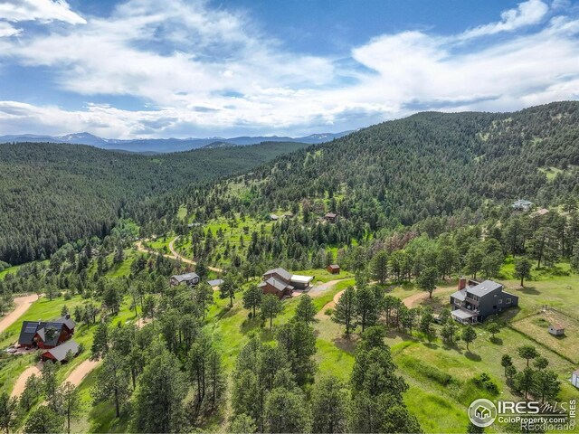 144 Coyote Ct, Boulder, CO 80302 - aerial view of a forest and a mountainous background