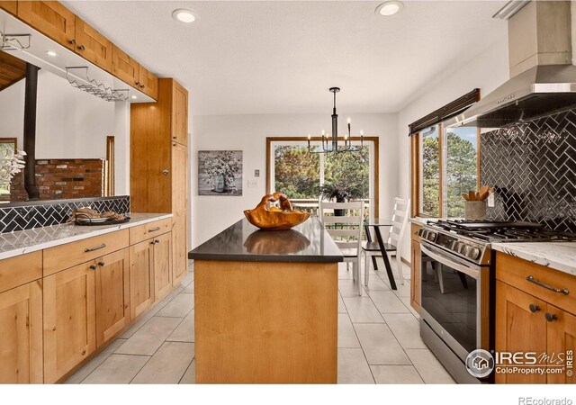 144 Coyote Ct, Boulder, CO 80302 - kitchen with stainless steel range with gas stovetop, wall chimney exhaust hood, tasteful backsplash, recessed lighting, and a chandelier