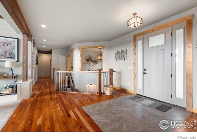 37044 Soaring Eagle Cir, Severance, CO 80550 - entrance foyer featuring wood finished floors and recessed lighting