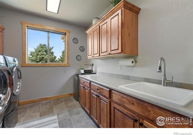 37044 Soaring Eagle Cir, Severance, CO 80550 - laundry room featuring cabinet space and washing machine and clothes dryer