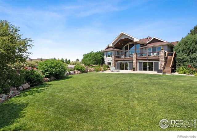37044 Soaring Eagle Cir, Severance, CO 80550 - rear view of property with a patio, a lawn, stairs, and a wooden deck