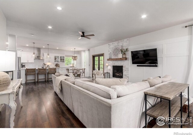 3290 Discovery Ct, Broomfield, CO 80023 - living room with ceiling fan, recessed lighting, dark wood finished floors, and a fireplace