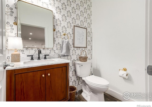 3290 Discovery Ct, Broomfield, CO 80023 - bathroom with vanity and wallpapered walls