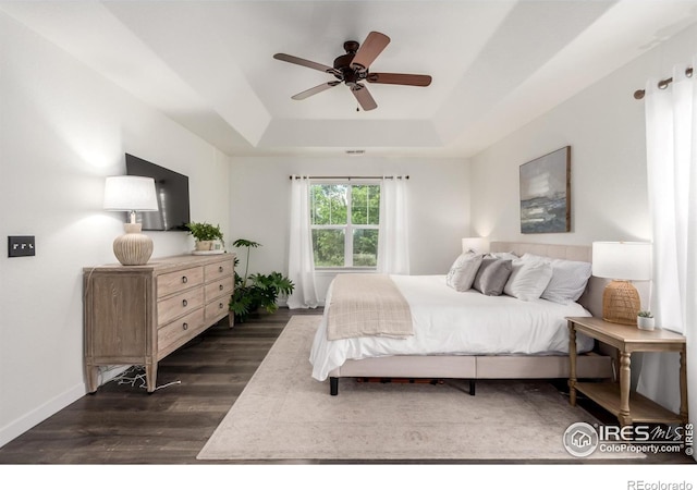 3290 Discovery Ct, Broomfield, CO 80023 - bedroom featuring a raised ceiling, dark wood finished floors, and ceiling fan