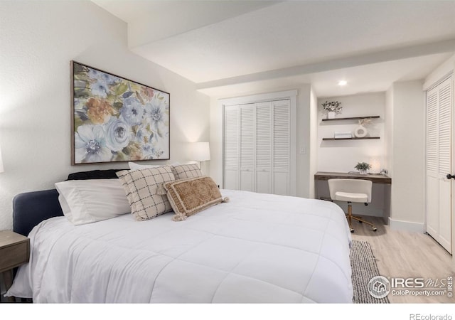 3290 Discovery Ct, Broomfield, CO 80023 - bedroom with wood finished floors and built in study area